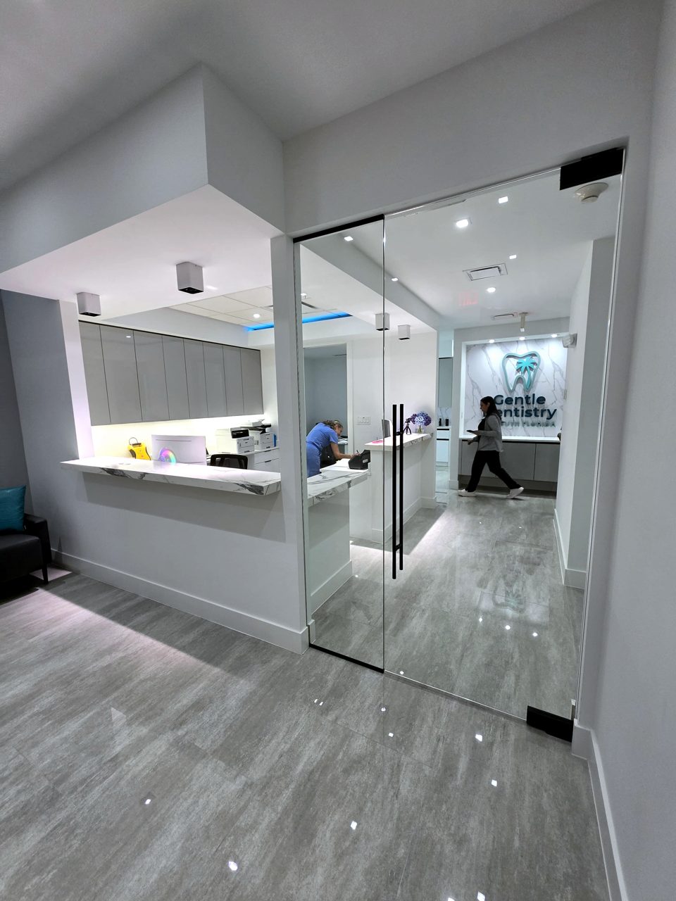 Glass office front with frameless glass door