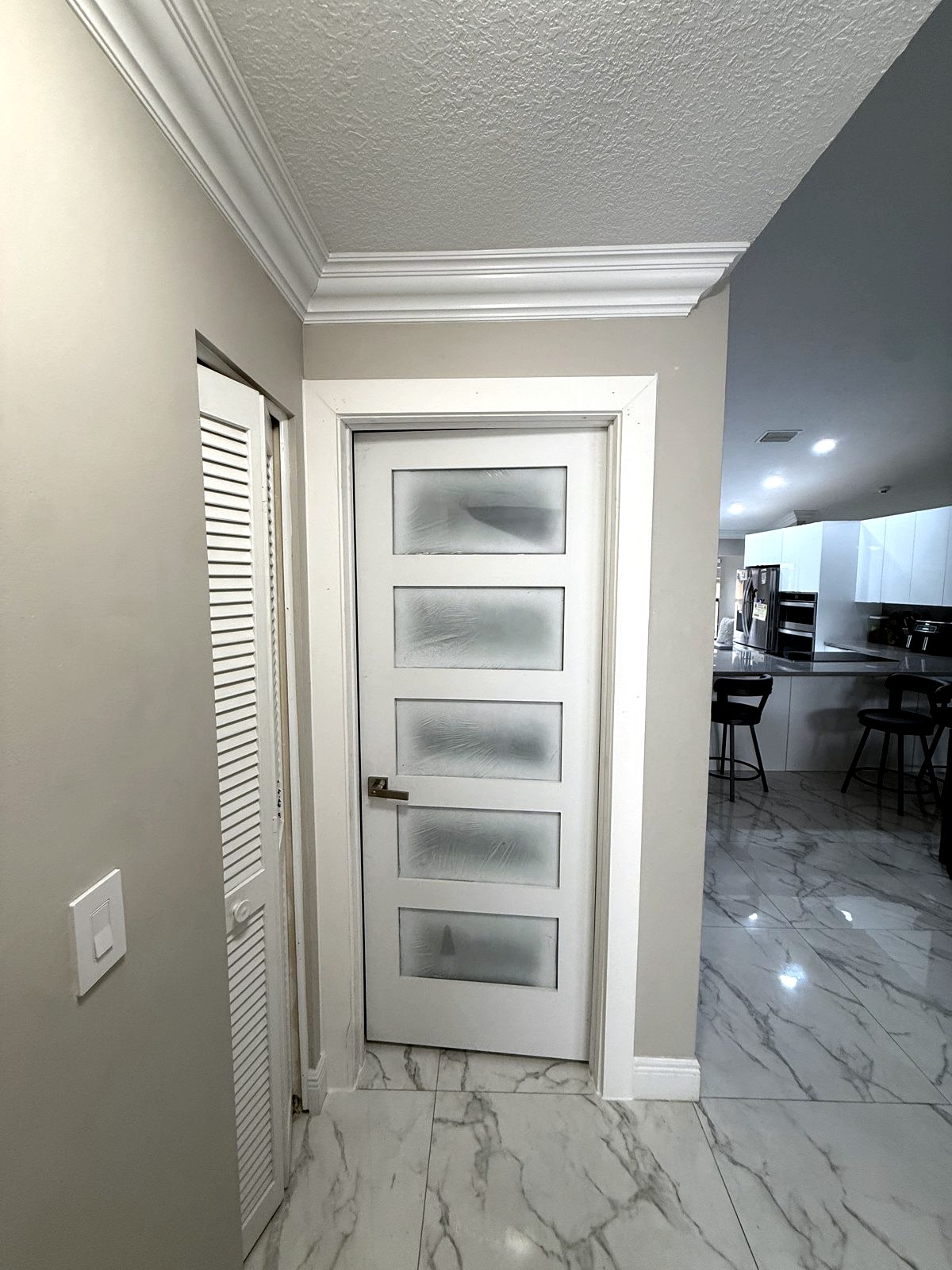 Frameless frosted glass interior door